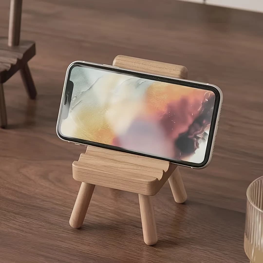 A chair-shaped mobile phone stand with three slots for stable support, suitable for large, medium and small-sized mobile phones