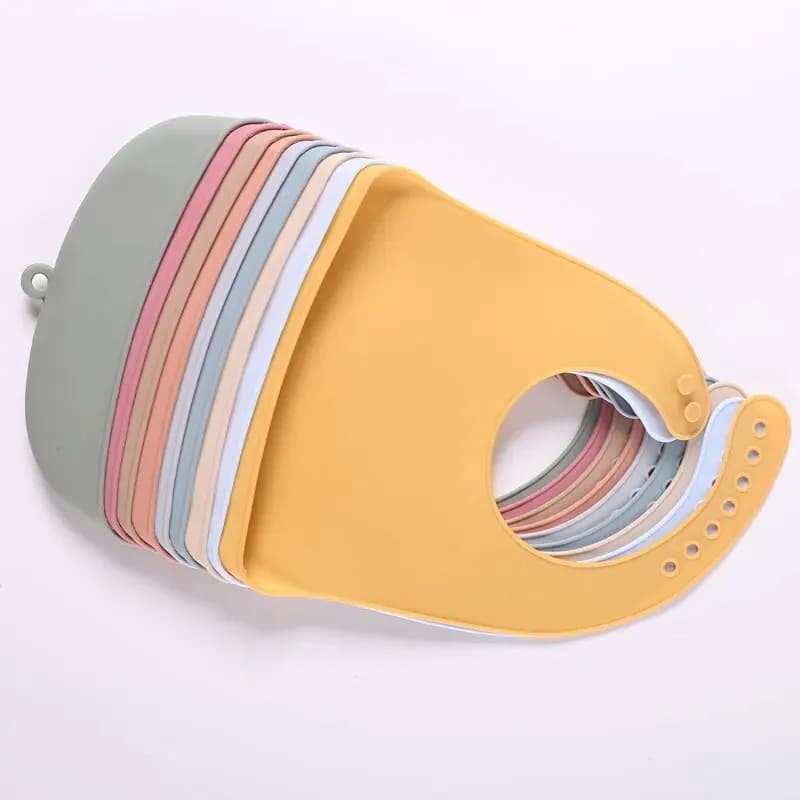 The baby feeding bib is made of silicone and has a water-resistant design. It is suitable for feeding purposes.