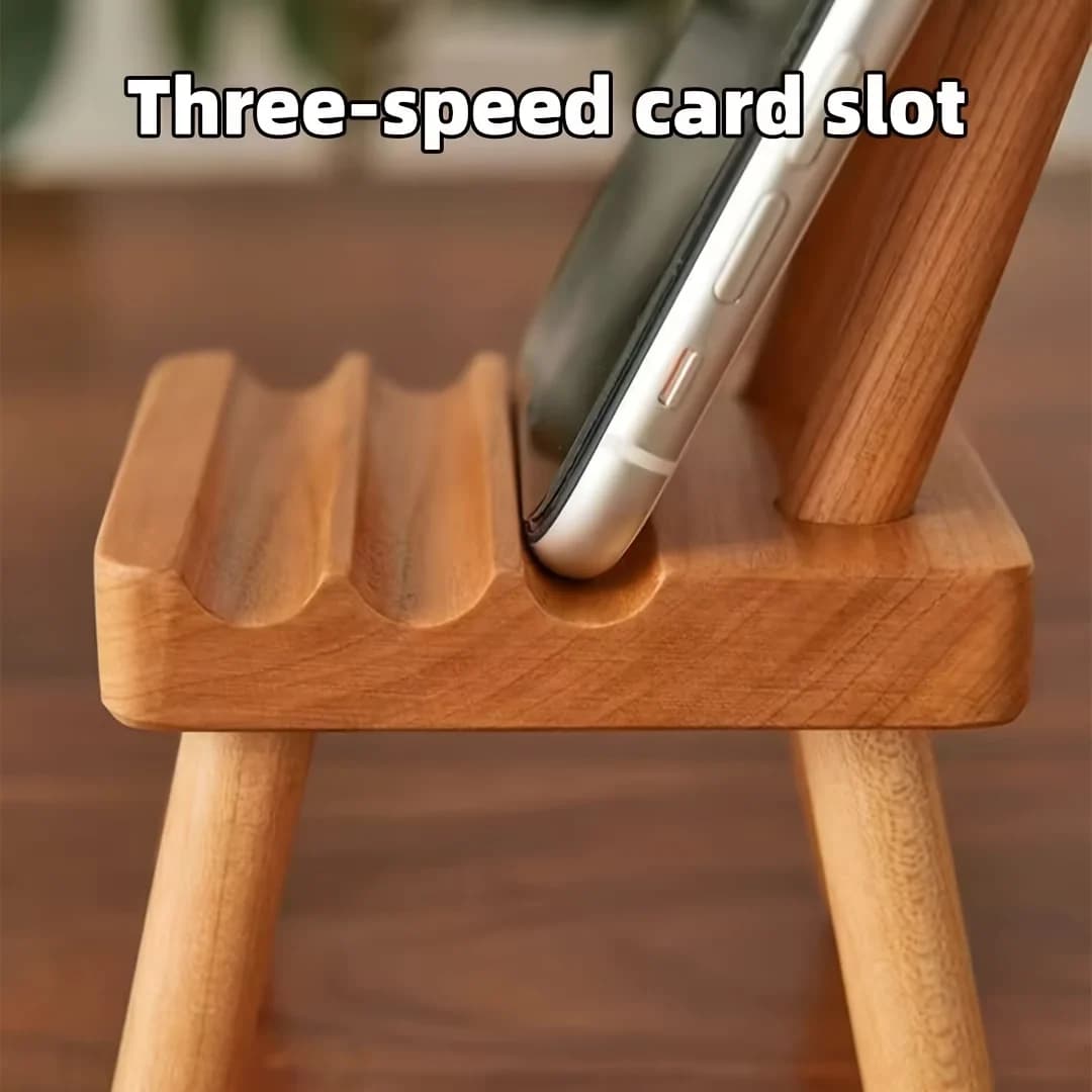 A chair-shaped mobile phone stand with three slots for stable support, suitable for large, medium and small-sized mobile phones